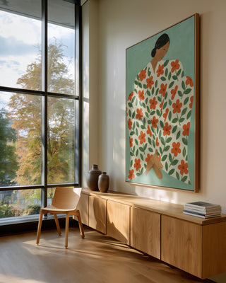 Large artwork "Stumblin' In" by Martina Karlsson hangs in a bright, modern room with wood furniture and large windows.