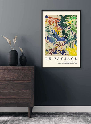 Framed Matisse Inspired Landscape in France Plakat displayed on a dark wall above a modern wooden dresser.