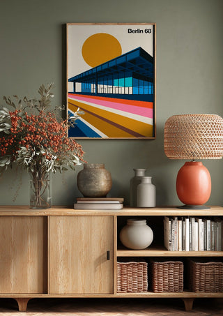 Berlin 68 by Bo Lundberg above a wooden sideboard on a sage green wall