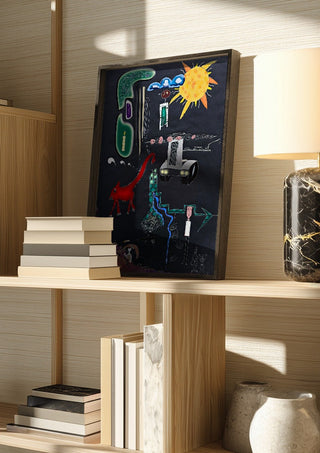 A Day In A Life by Art Guveau in a dark frame on a wooden shelf beside books and a lamp