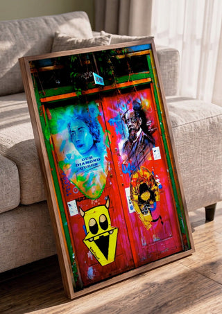 Graffiti Door by Pelecan Schneider in a walnut frame leaning against a grey sofa