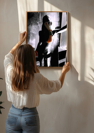 Beauty The Beast by Pelecan Schneider being hung on a sunlit wall