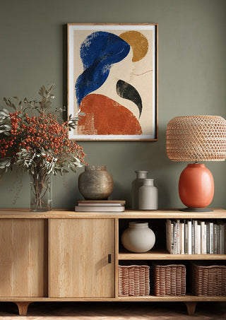The Shape of Silence by Matthews Gallerie above a wooden sideboard on a sage green wall