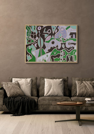 Love is All by Andreas Pohle in a light wood frame above a grey sofa with cushions