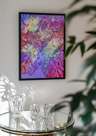 Petal Ridge by Da Winters in a black frame above a glass table with crystal glassware
