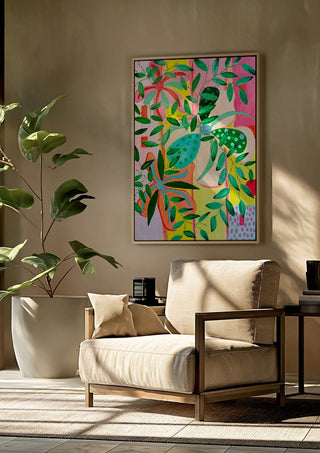 Bloom by LGDyrby framed above a beige armchair beside a potted plant