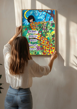 To Plant a Garden by Camilla Nilsson being hung on a sunlit wall