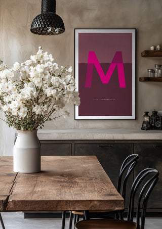 M as in Mind-blowing – Cerise by Quite Nice Prints in a black frame above a rustic table with white flowers