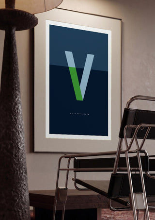 V as in Va-va-voom – Blue by Quite Nice Prints framed in a dim room beside a tubular steel chair