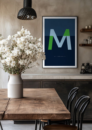 M as in Mind-blowing – Blue by Quite Nice Prints in a black frame above a rustic table with white flowers
