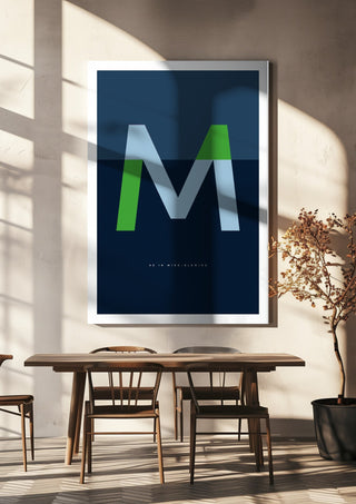 M as in Mind-blowing – Blue by Quite Nice Prints hanging above a wooden dining table in warm sunlight