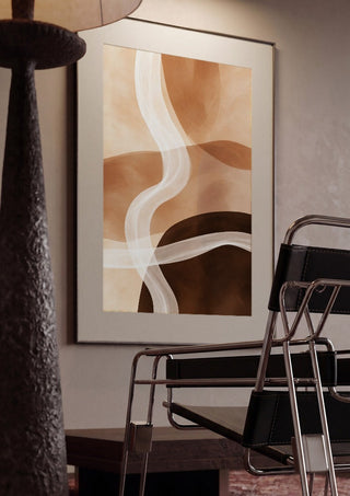 Sand and Clay by Martina Karlsson framed in a dim room beside a tubular steel chair