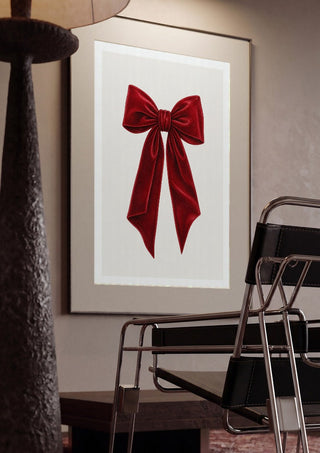 Red velvet bow by Ohkimiko framed in a dim room beside a tubular steel chair
