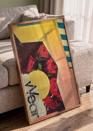 Roses by Kareem Rizk in a walnut frame leaning against a grey sofa