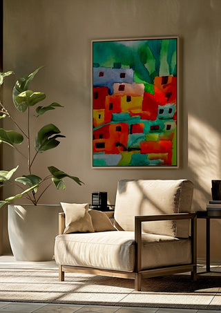 Houses of Favela by Nittaart framed above a beige armchair beside a potted plant