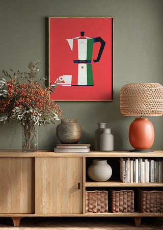 Italian coffee by Bo Lundberg above a wooden sideboard on a sage green wall
