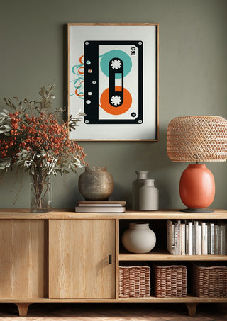 Mixtape by Bo Lundberg above a wooden sideboard on a sage green wall