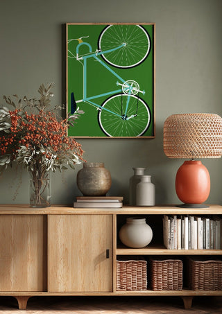 Italian Racing Bike by Bo Lundberg above a wooden sideboard on a sage green wall
