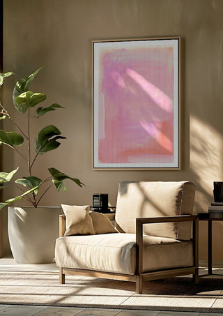 soft atmospheric colorfields by Iris Lehnhardt framed above a beige armchair beside a potted plant