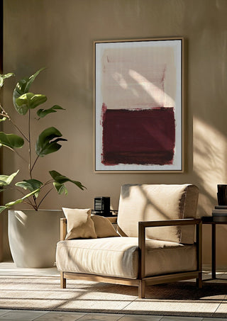 colorfields pale pink warm red by Iris Lehnhardt framed above a beige armchair beside a potted plant