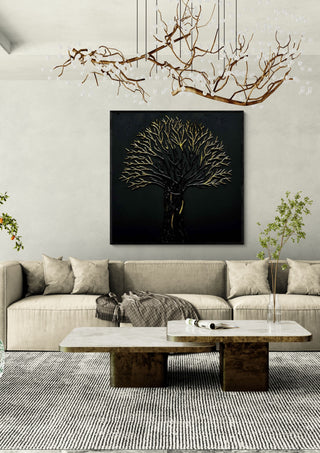 The Golden Tree by Marcel Herrmann in a black frame above a cream sofa under a branch chandelier