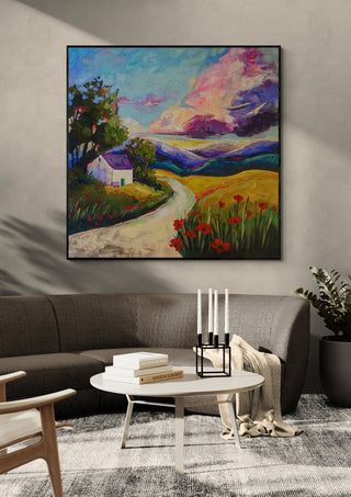 A Place to Return To by Evgenia Smirnova in a black frame above a dark sofa with candlesticks on a round table
