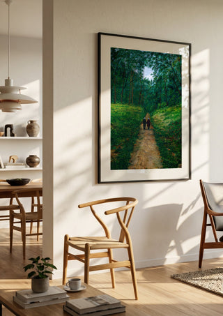 The way of live by Juergen Duerrmann in a black frame in a bright dining room with wooden chairs