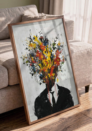 Headbloom x Banksy by Decker Studios in a walnut frame leaning against a grey sofa