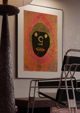 GOA by Ali Kasap framed in a dim room beside a tubular steel chair