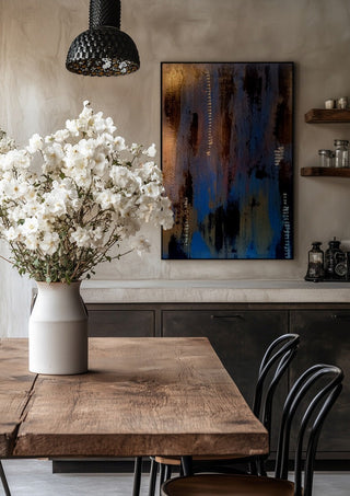 Script in Blue and Copper by Kristof ellertz in a black frame above a rustic table with white flowers
