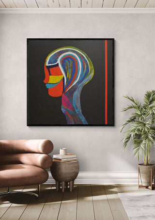 RED LINE by Ali Kasap in a black frame above a leather armchair beside a palm
