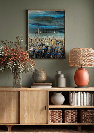 Blue fields by Lüba above a wooden sideboard on a sage green wall