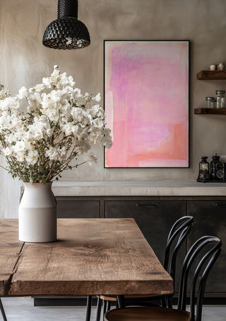 soft atmospheric colorfields by Iris Lehnhardt in a black frame above a rustic table with white flowers
