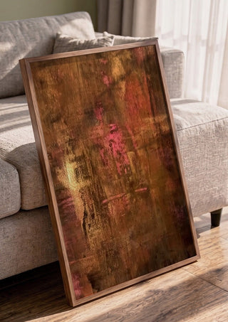 Copper and Rose by Kristof ellertz in a walnut frame leaning against a grey sofa