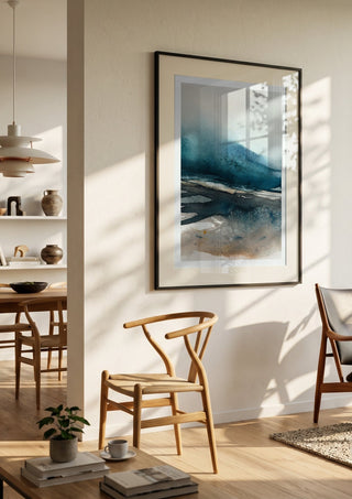 Imposed memories by Tania Zubareva in a black frame in a bright dining room with wooden chairs