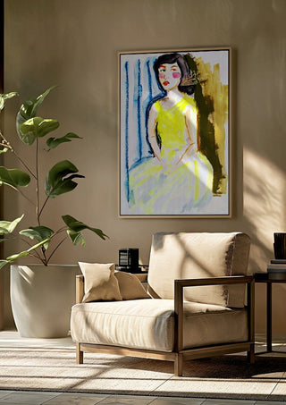 Yellow Dress by DNF framed above a beige armchair beside a potted plant