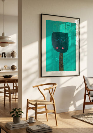 Pricken by RR in a black frame in a bright dining room with wooden chairs