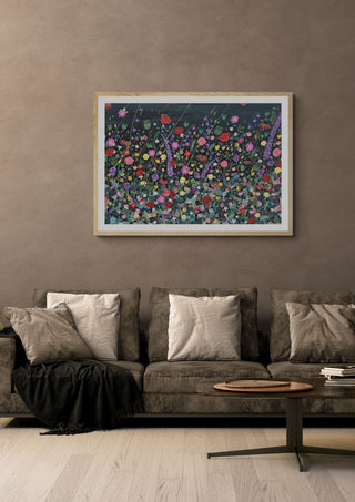 Corfe House by Rebecca Wright in a light oak frame on a warm grey wall above a brown sofa