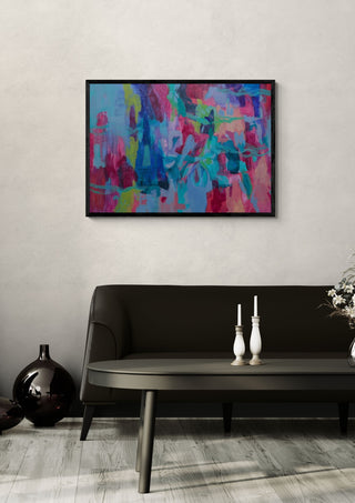 In The Flow by Janet Bell in a black frame on a pale wall above a dark sofa with candlesticks
