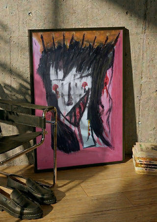 Onschuldig Wezen - Innocent Creature by Mizo in a black frame leaning against a concrete wall by a steel chair