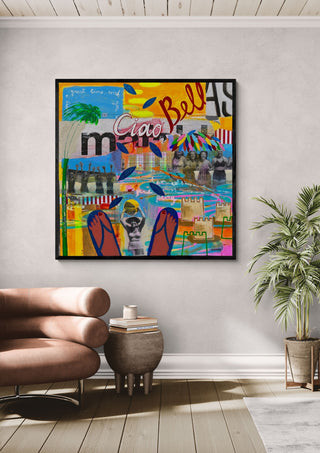 Ciao Bellas by María Burgaz in a black frame above a rose-pink armchair beside a palm
