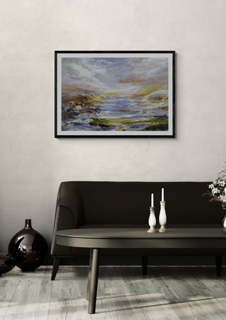 Destiny unknown by Art Anne Lee in a black frame on a pale wall above a dark sofa with candlesticks