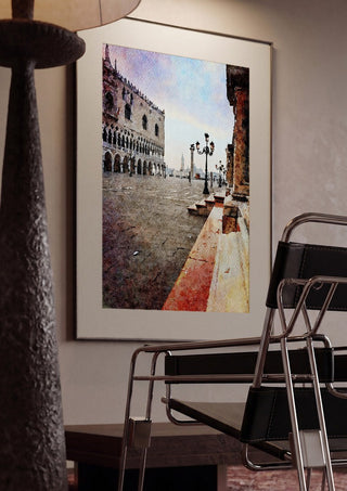 Venezia by Massimo Frascogna framed in a dim room beside a tubular steel chair