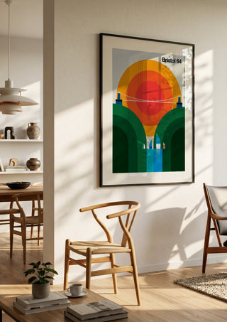 Bristol 64 by Bo Lundberg in a black frame in a bright dining room with wooden chairs
