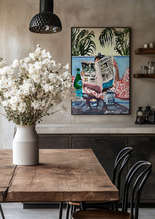 Sunday read at The Phoenicia, Malta by Mariam De Giorgio in a black frame above a rustic table with white flowers