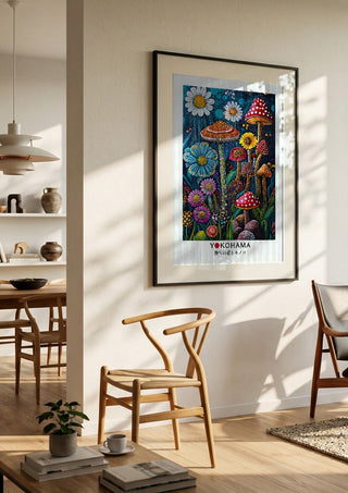 Wild Flowers and Mushrooms by Yokohama in a black frame in a bright dining room with wooden chairs