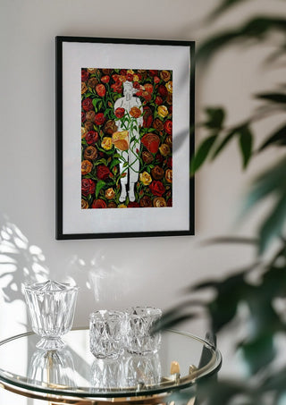 She stands in Bloom by Madame Petit in a black frame above a glass table with crystal glassware