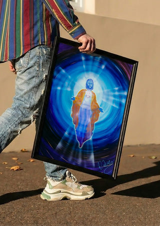 Jesus by Walter Zettl carried in a black frame along a sunny street