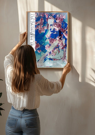 cherry baily by hazelart being hung on a sunlit wall