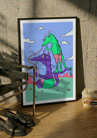 Crocodiles Friends by Elisa Albanelli in a black frame leaning against a concrete wall by a steel chair